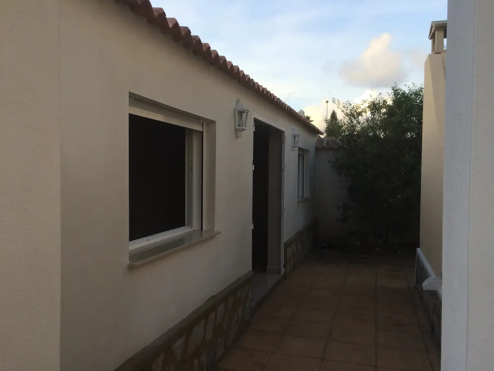 Outdoor patio with porcelain paving and stone base course renovated by URPE Spain
